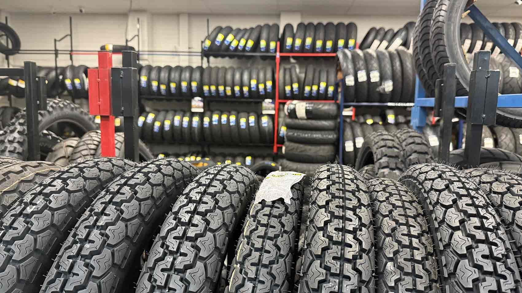 Motorcycle Tires Displayed for Sale in a Shop, Organized on Shelves — Newcastle Motorcycle Tyres in Broadmeadow, NSW
