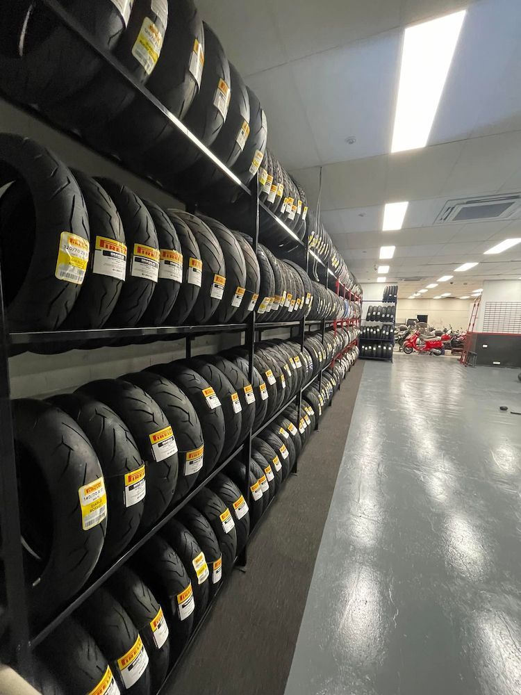 A Warehouse Filled With Lots of Motorcycle Tyres — Newcastle Motorcycle Tyres in Broadmeadow, NSW