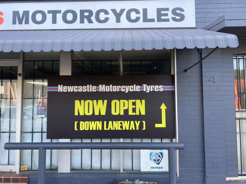 A Newcastle Motorcycle Tyres Sign Board — Newcastle Motorcycle Tyres in Broadmeadow, NSW