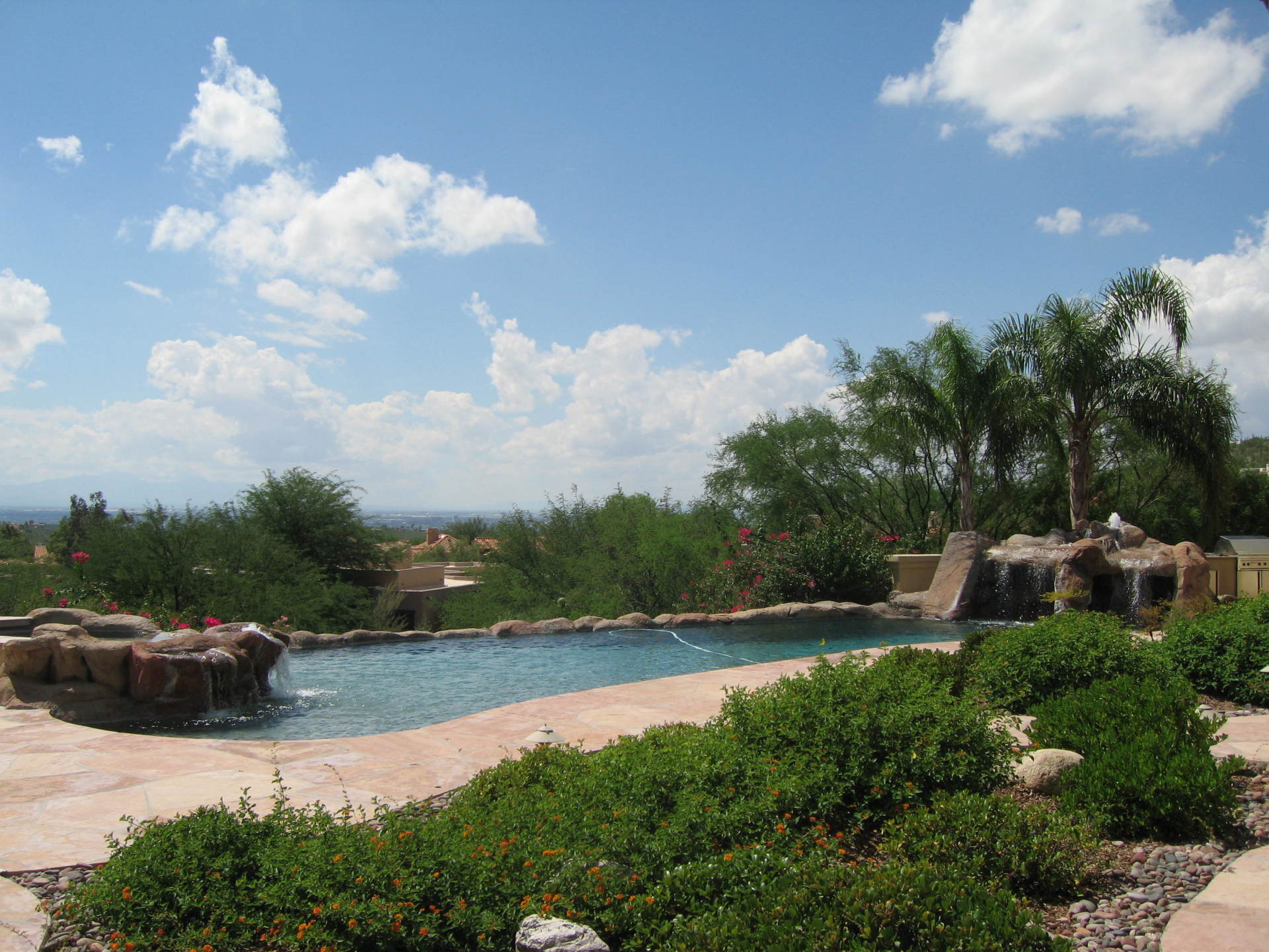 Pool Side — Man Cleaning the Pool in Tucson, AZ