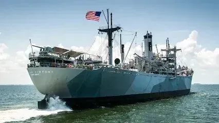 Hvac-Contractor-Bradenton-A large US Navy ship sailing on the water with an American flag.
