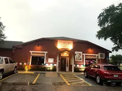Hvac-Contractor-Bradenton-A red car is parked in front of a building.
