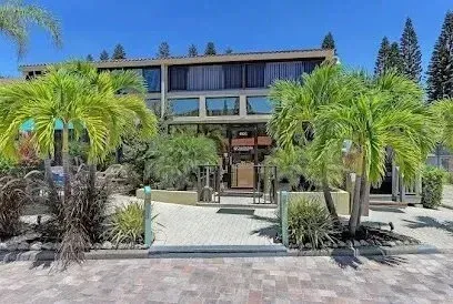 Hvac-Contractor-Bradenton-A large building with palm trees in front of it