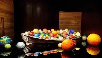 Hvac-Contractor-Bradenton-A bowl filled with colorful marbles is sitting on a table.