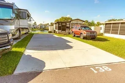 Hvac-Contractor-Bradenton-A red suv is parked in a driveway next to a rv.