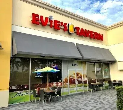 Hvac-Contractor-Bradenton-A restaurant called evite 's tavern has tables and chairs outside