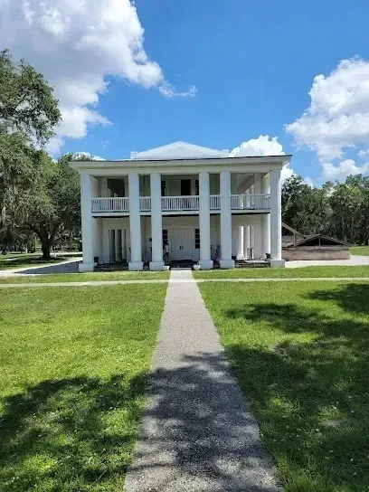 Hvac-Contractor-Bradenton-A large white house with a walkway leading to it