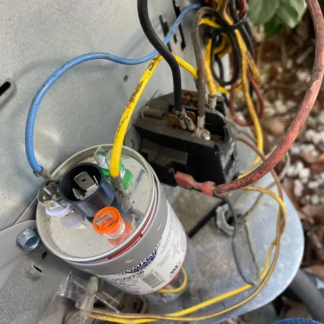 Hvac Contractor Bradenton - a close up of a capacitor with wires coming out of it