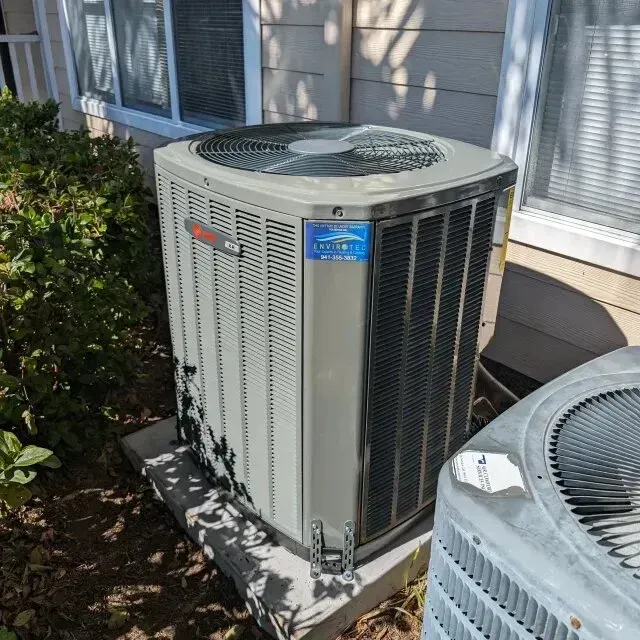 Hvac-Contractor-Bradenton-Air conditioning unit next to a smaller one outside a building.
