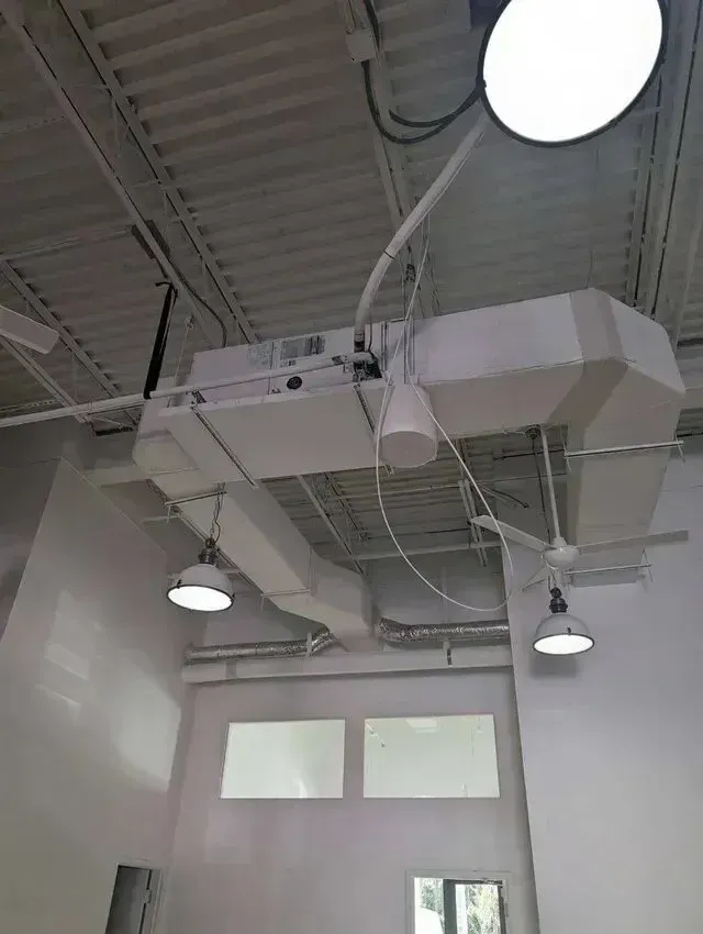 Hvac Contractor Bradenton - A ceiling with a lot of ducts and lights hanging from it.