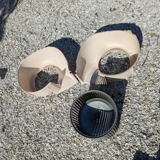 Hvac-Contractor-Bradenton-a couple of pieces of plastic are laying on the ground .