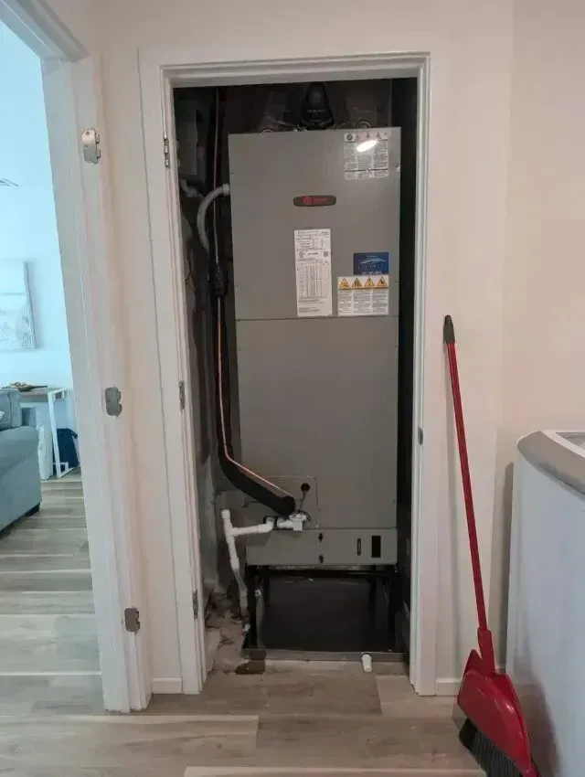 Hvac Contractor Bradenton - A room with a heater and a broom in it.