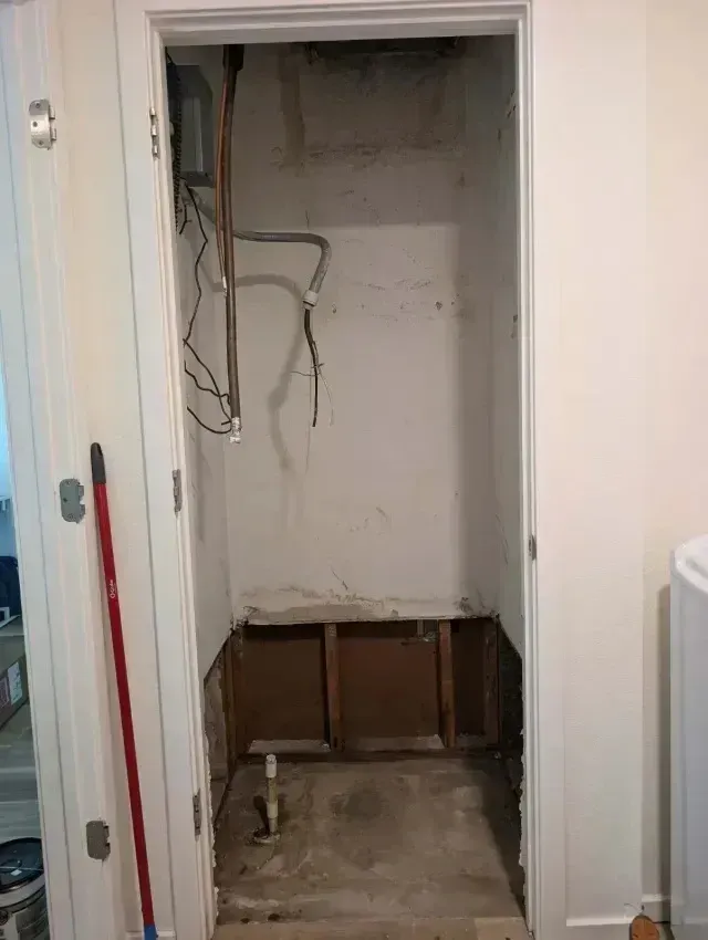 Hvac Contractor Bradenton - A closet with a door open and a broom in it.