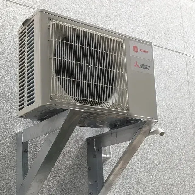 Hvac Contractor Bradenton - A mitsubishi air conditioner is mounted to a wall