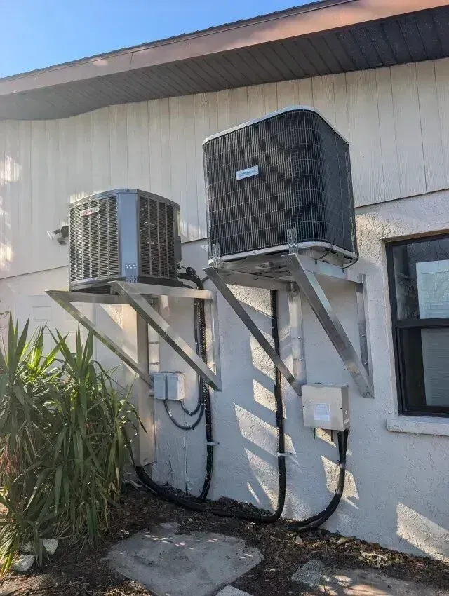 Hvac Contractor Bradenton - Two air conditioners are mounted on the side of a building.