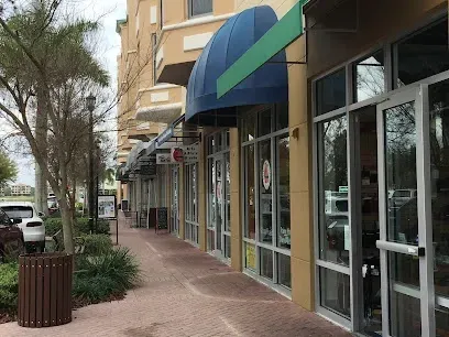 Hvac-Contractor-Bradenton-A row of stores with awnings on the side of them in a shopping center.