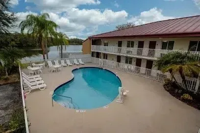 Hvac-Contractor-Bradenton-An aerial view of a hotel with a large swimming pool in front of it.