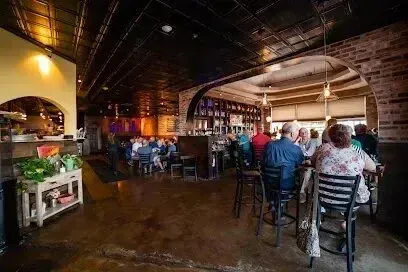 Hvac-Contractor-Bradenton-A group of people are sitting at tables in a restaurant.