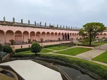 Hvac-Contractor-Bradenton-A large building with arches and a pond in front of it.