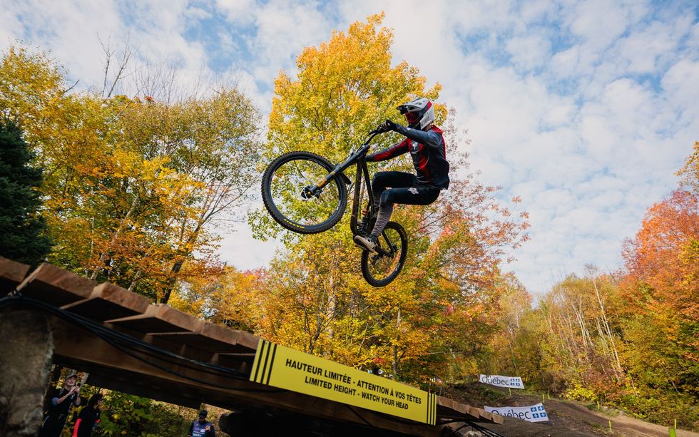 A person is doing a trick on a bike in the air.