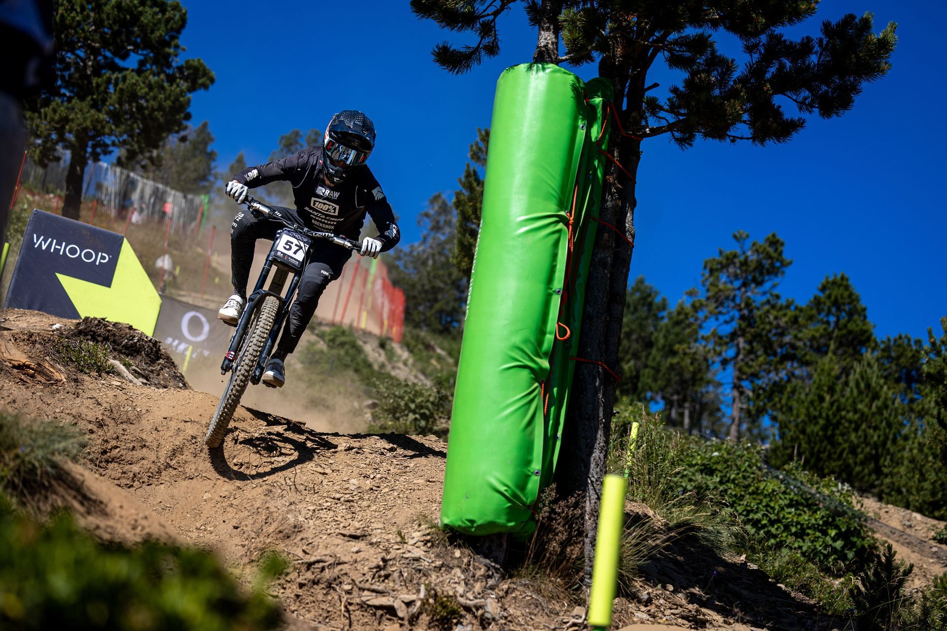 A person is riding a bike down a dirt trail.
