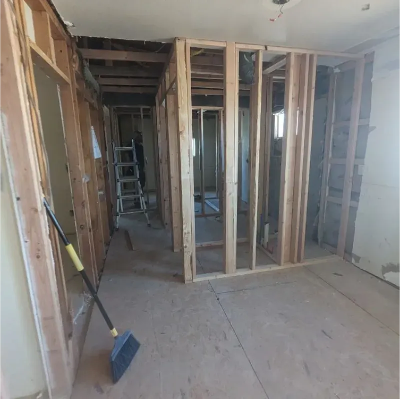 A room with a ladder and a shovel in it