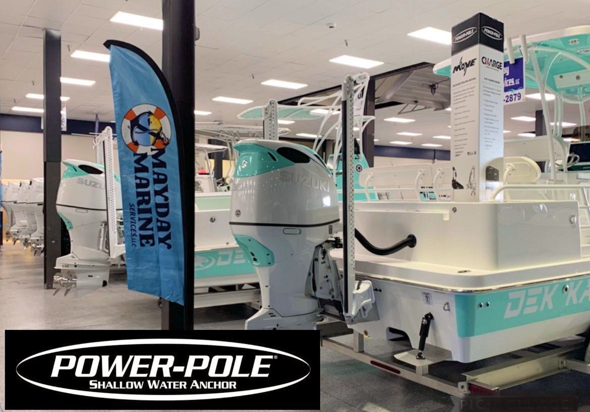 A boat is displayed in a power pole showroom.