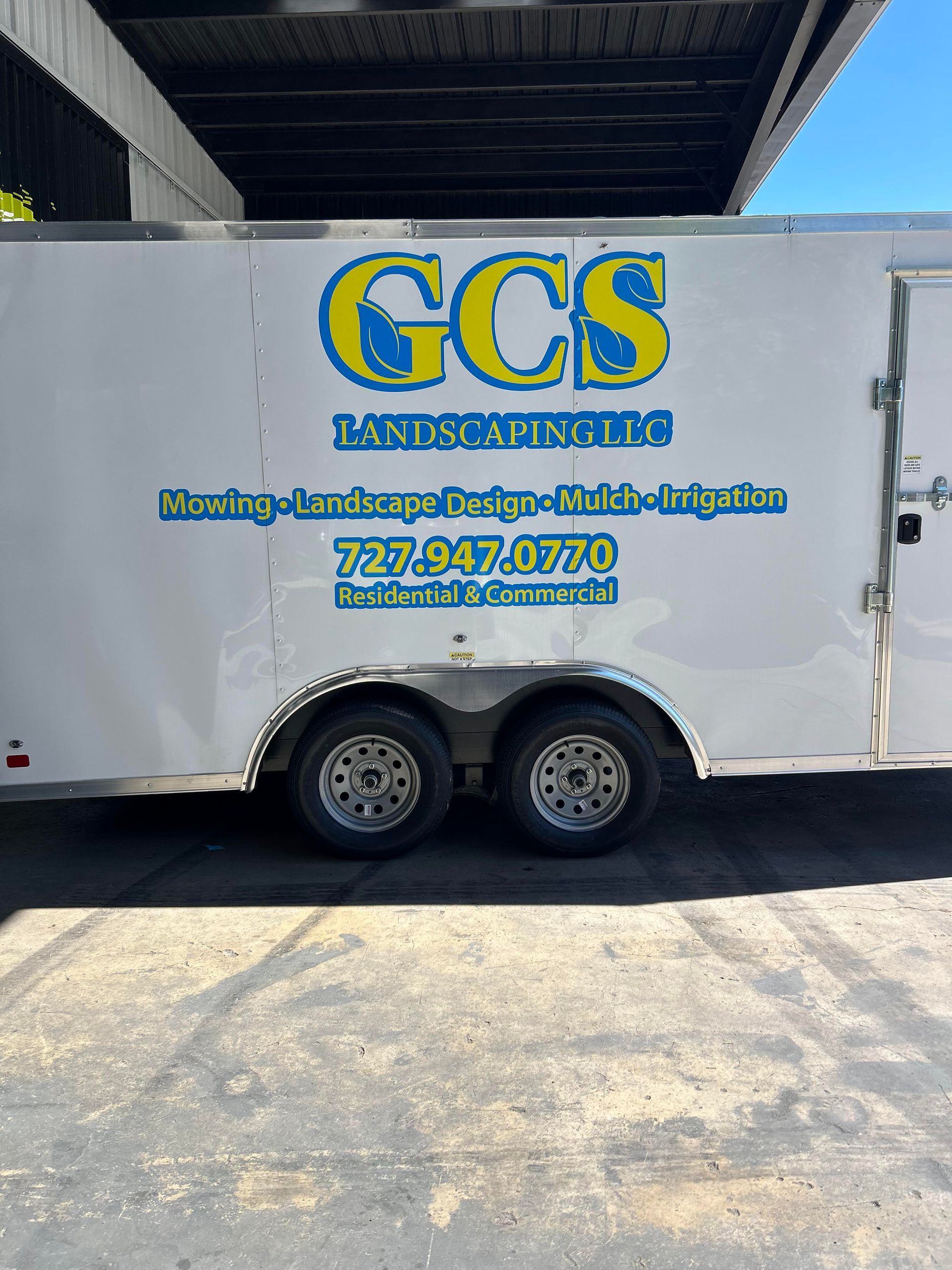 White trailer parked outdoors with 