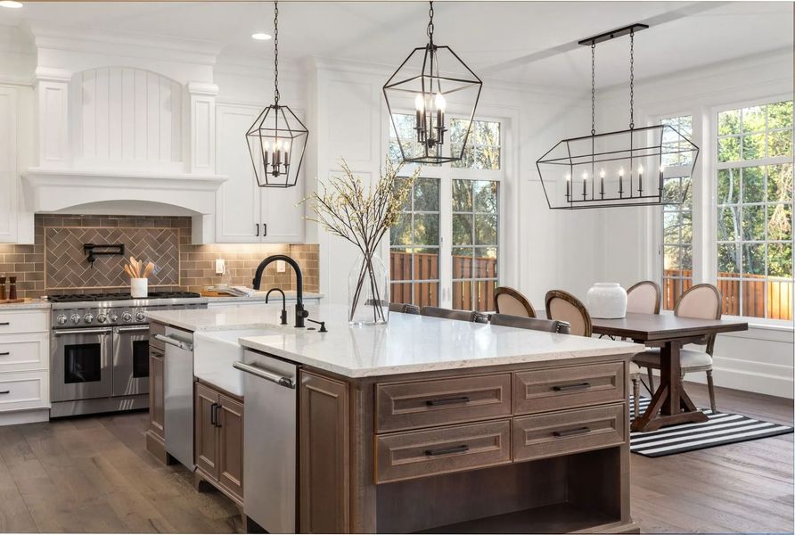 A kitchen with a large island in the middle of the room.