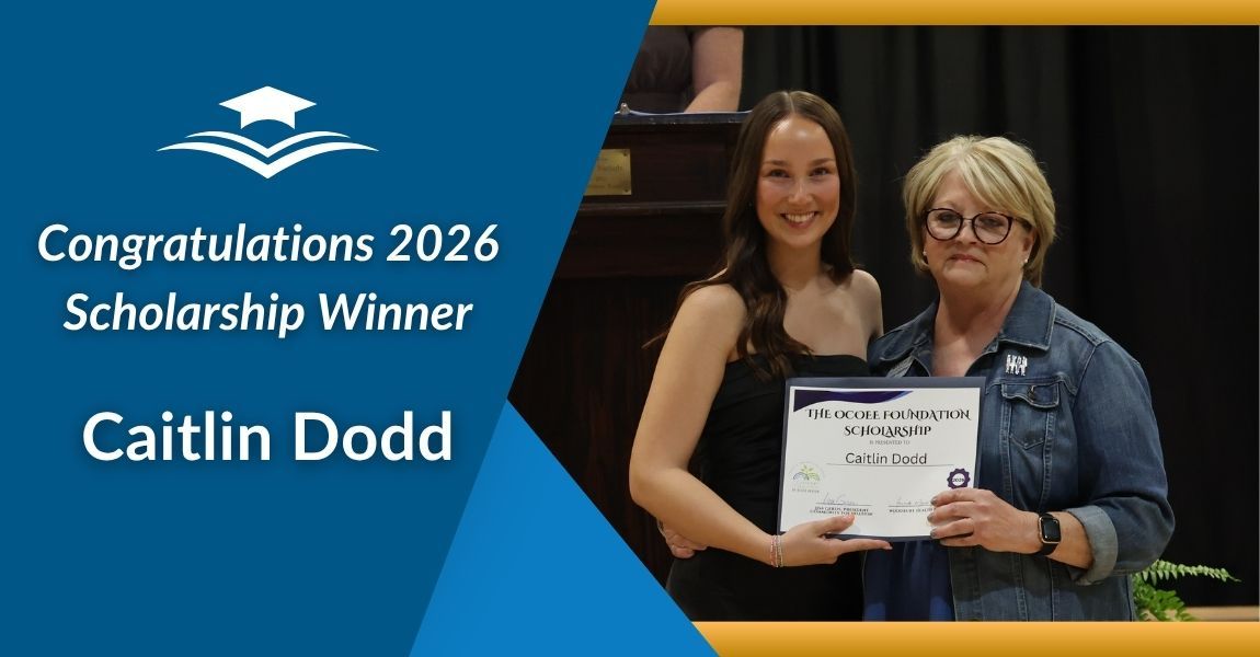 Congratulations 2026 Scholarship Winner Caitlin Dodd holding a certificate beside another woman on stage