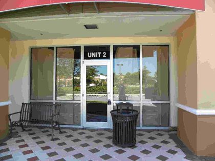 Building with Glass Doors — Commercial Store Front & Automatic Door Installation & Repair in Brandon, FL