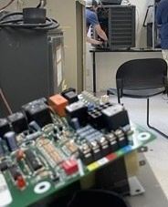 A woman is standing on a boat looking at the camera.