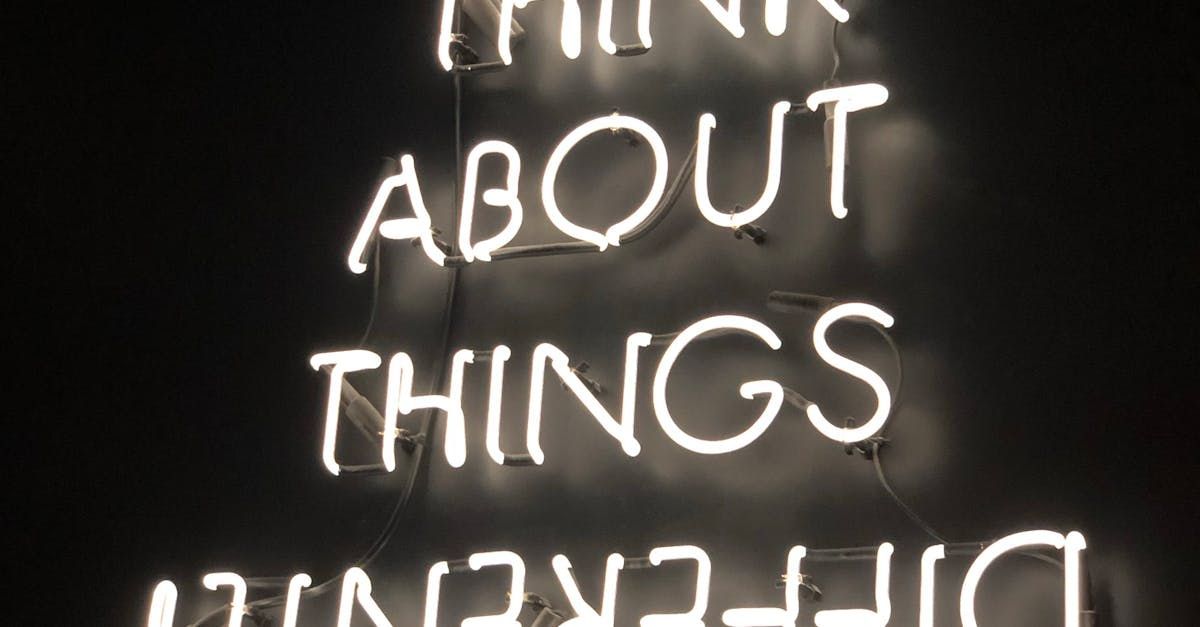 A neon sign that says `` about things '' is lit up in the dark.
