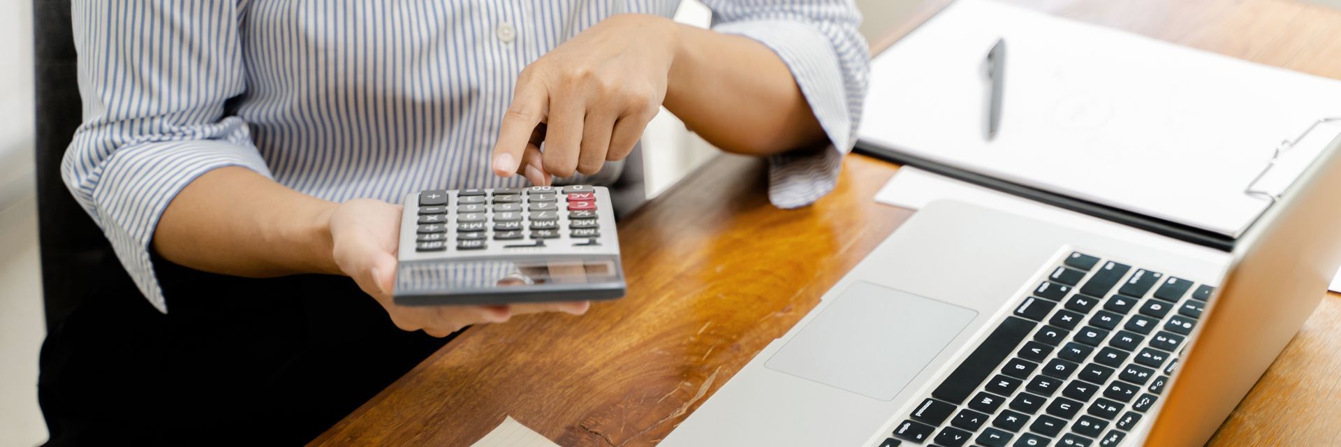 Woman using calculator - Pine Bush, NY - JPM Bookkeeping Services