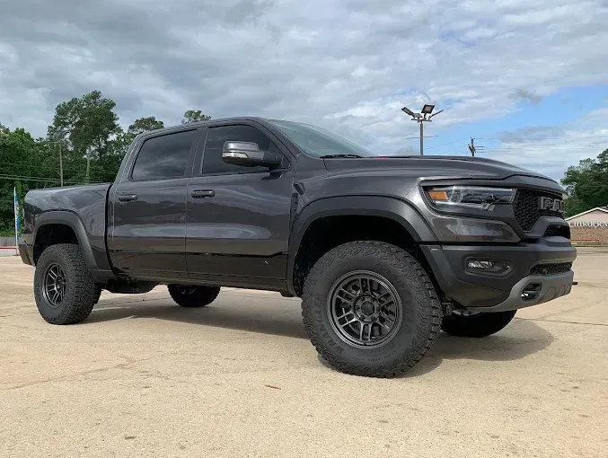 Gray RAM TRX pickup truck on pavement, outdoors.
