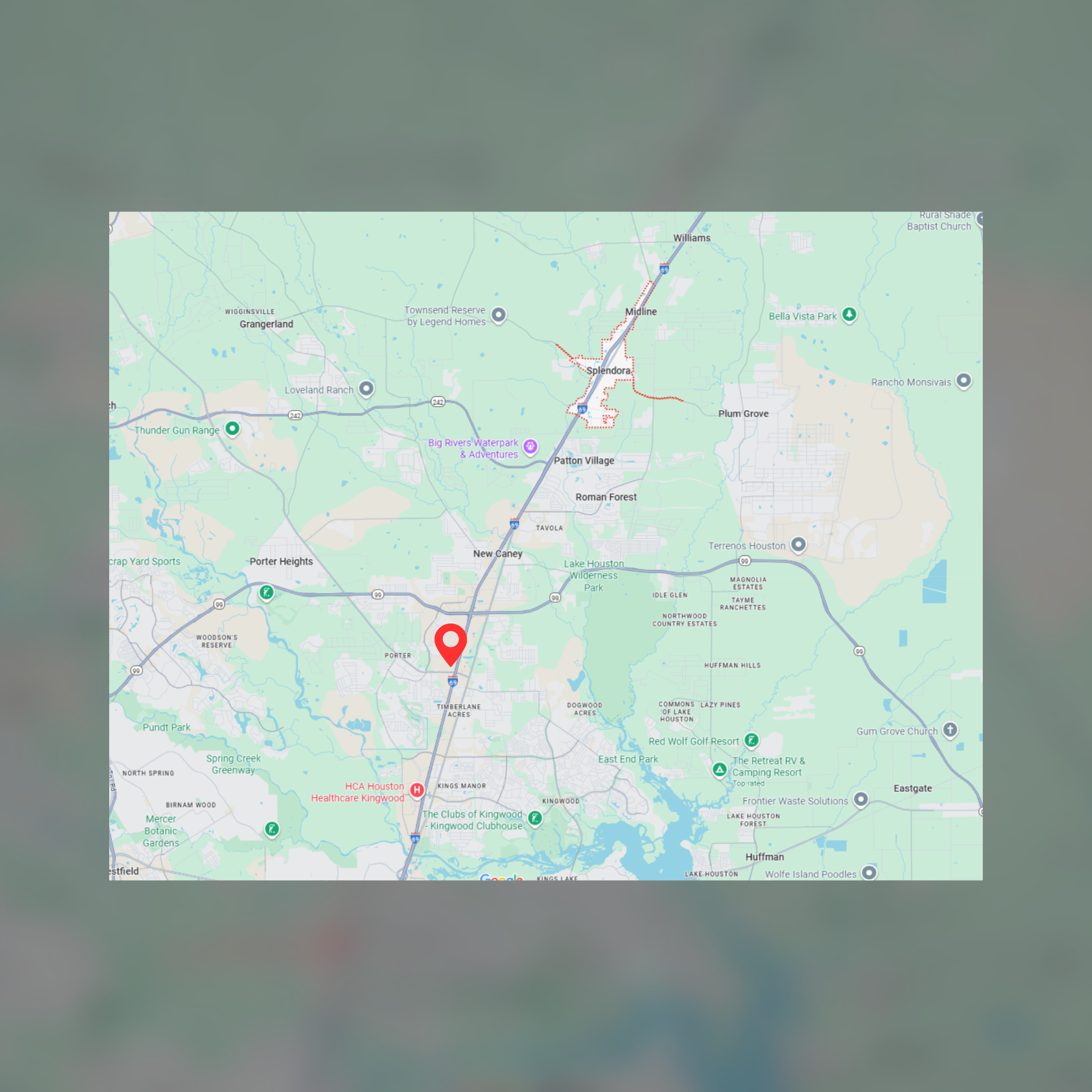 Map with a red marker indicating a location in a green and light blue area.