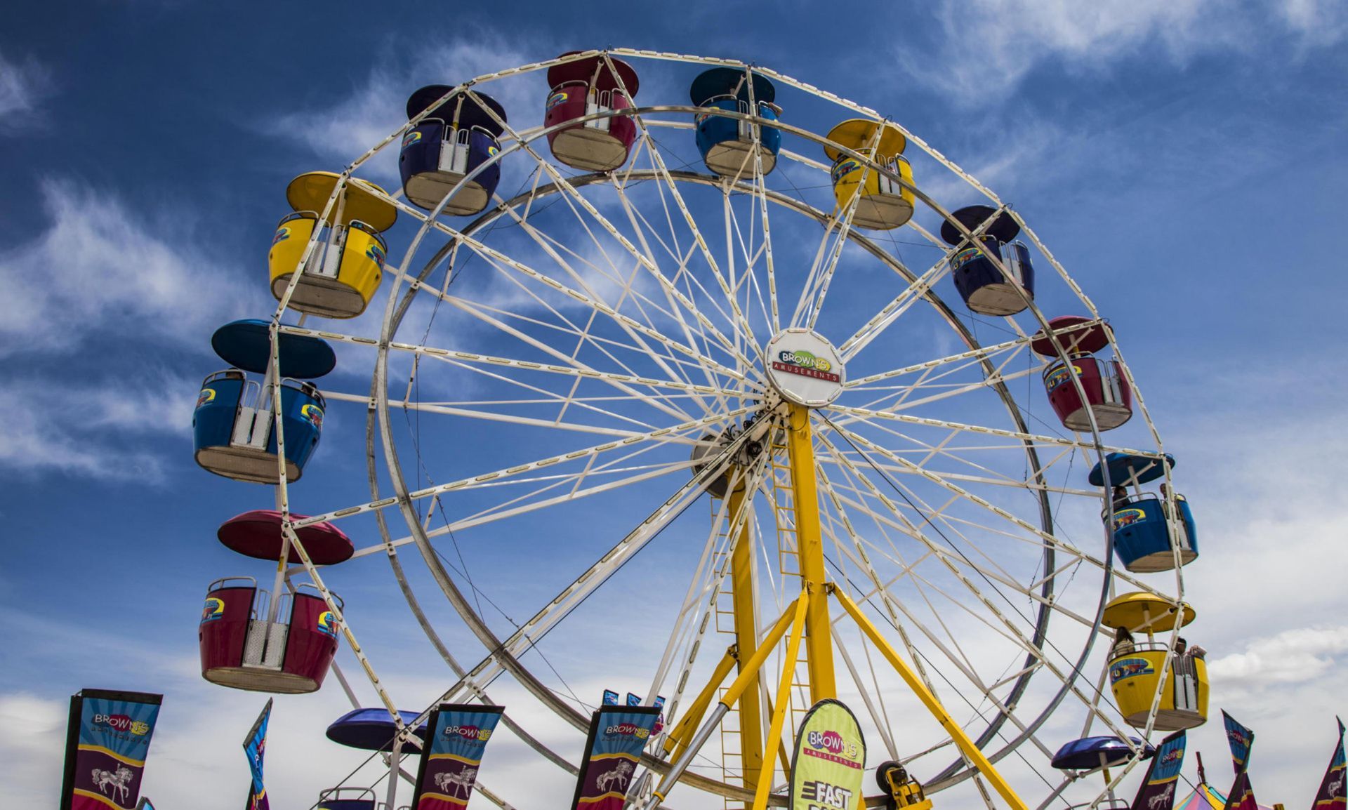 A ferris wheel with a blue sky in the background