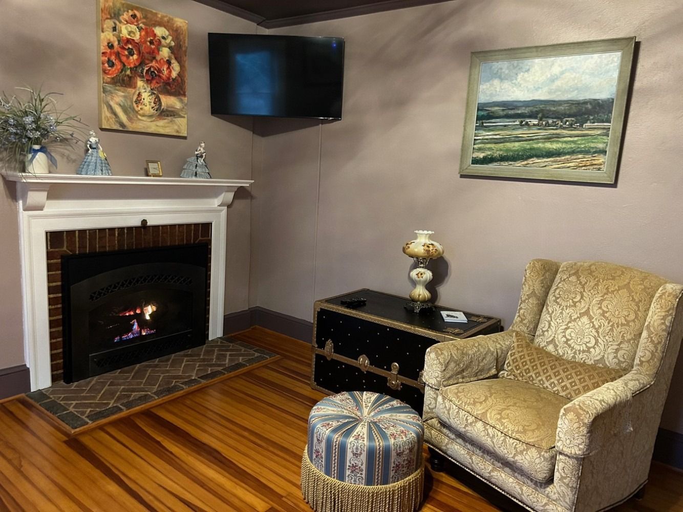 A living room with a fireplace and a chair