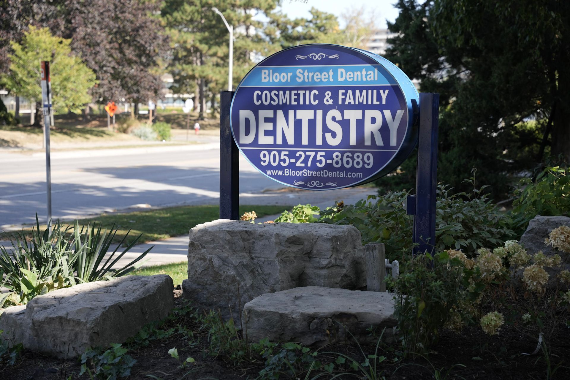 a sign for bloor street dental cosmetic & family dentistry | Outside a dental practice | Bloor Street Dental | Best Family and Cosmetic Dentist In Mississauga For Implants, Braces, and Invisalign
