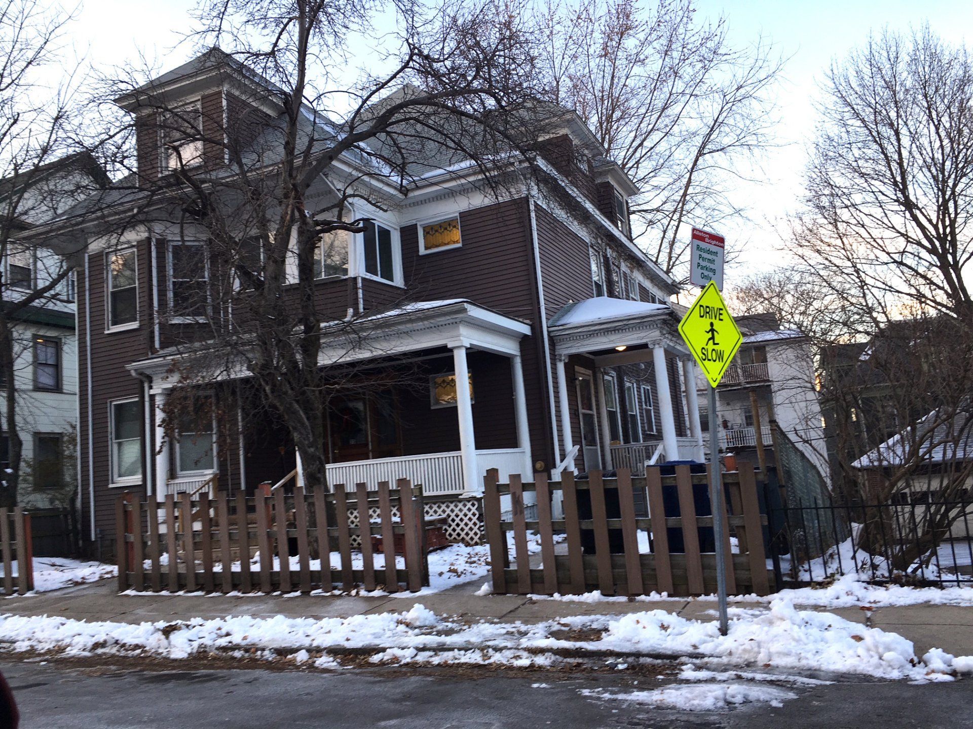 A house with a yellow sign that says no left turn