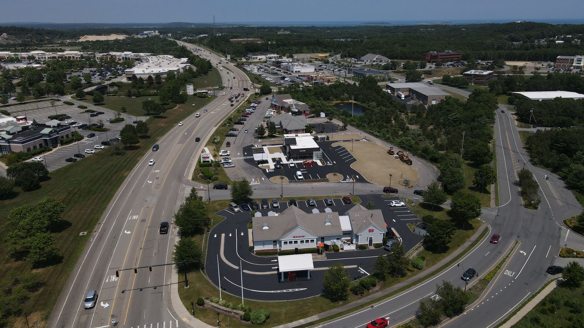 An aerial view of a highway and a parking lot