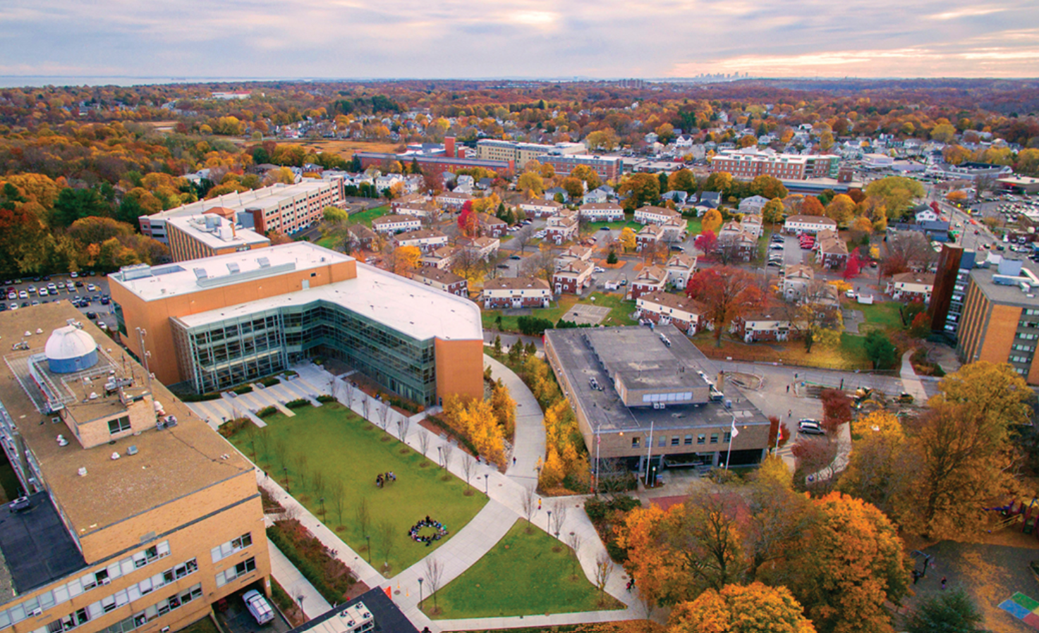 An aerial view of a city with lots of buildings and trees.