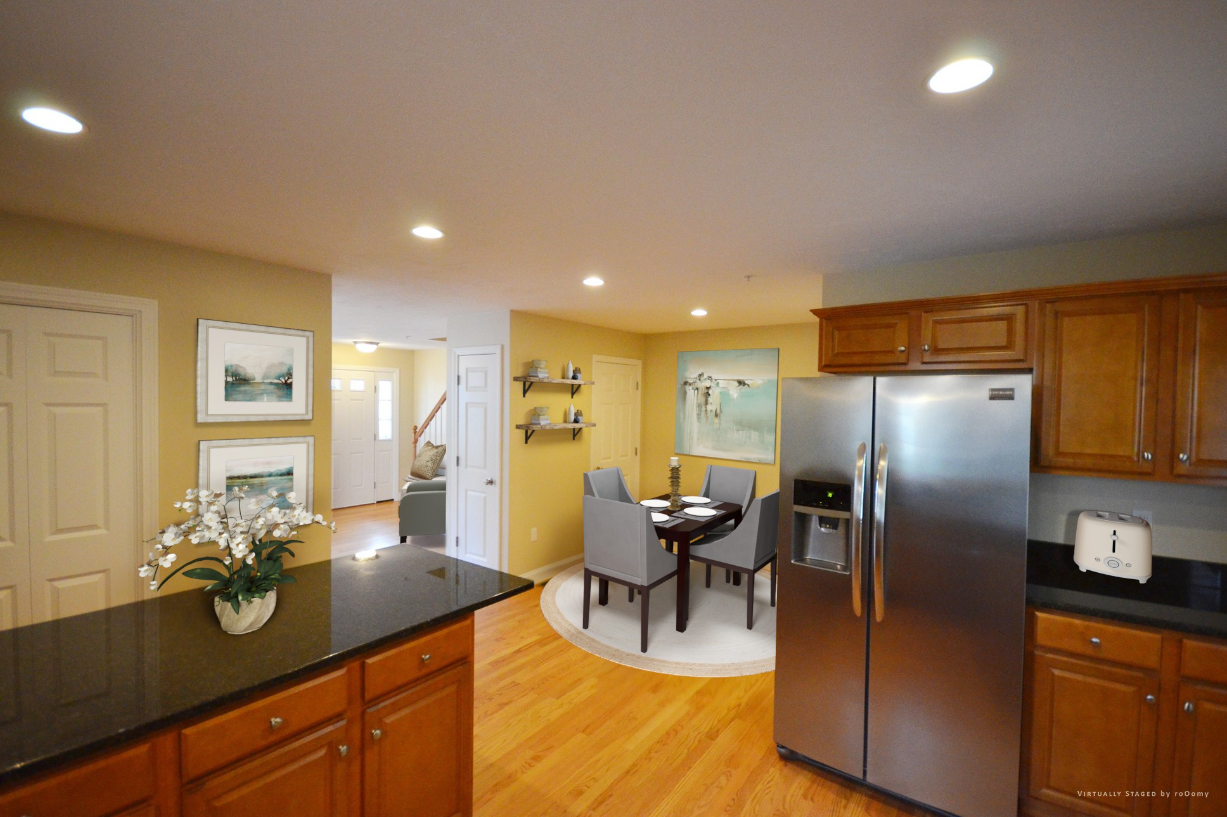 A kitchen with stainless steel appliances and wooden cabinets