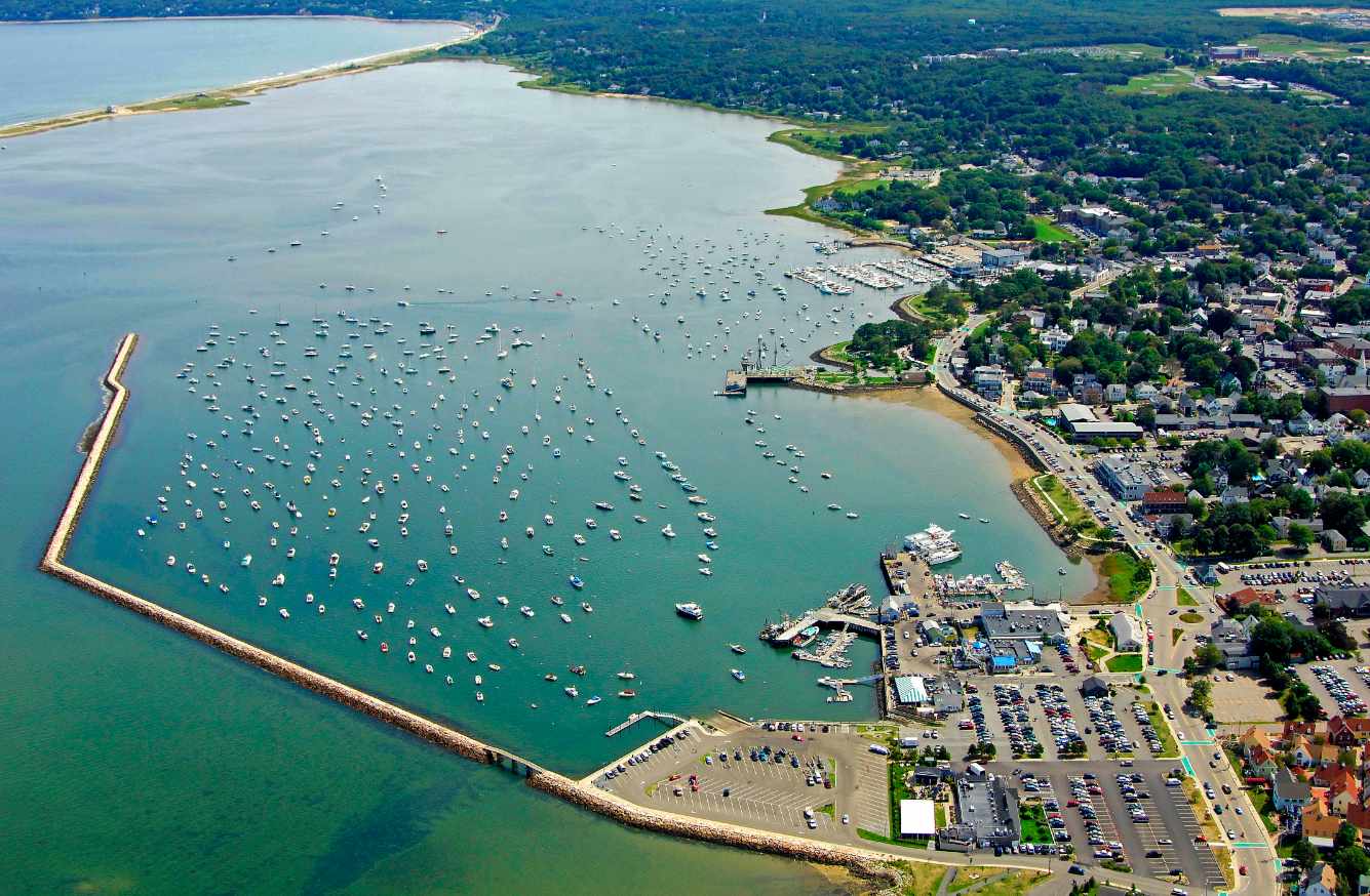 An aerial view of a harbor with many boats in it