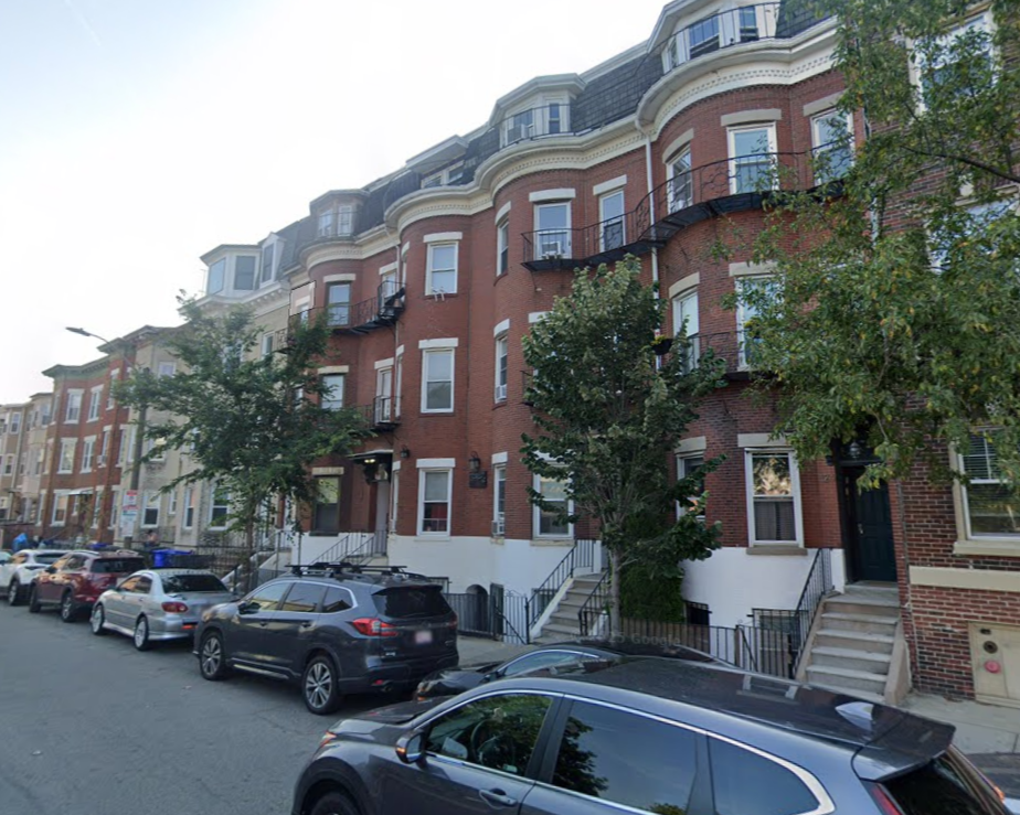 A large brick building with a fire escape on the side