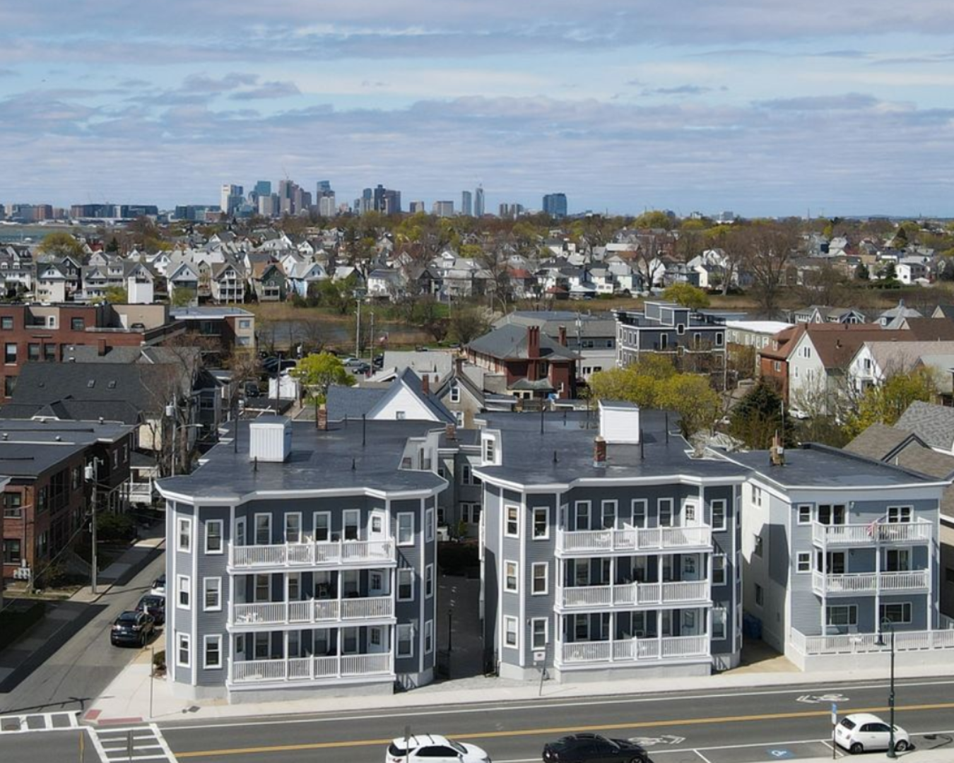 A large building with a lot of windows and balconies on a sunny day.