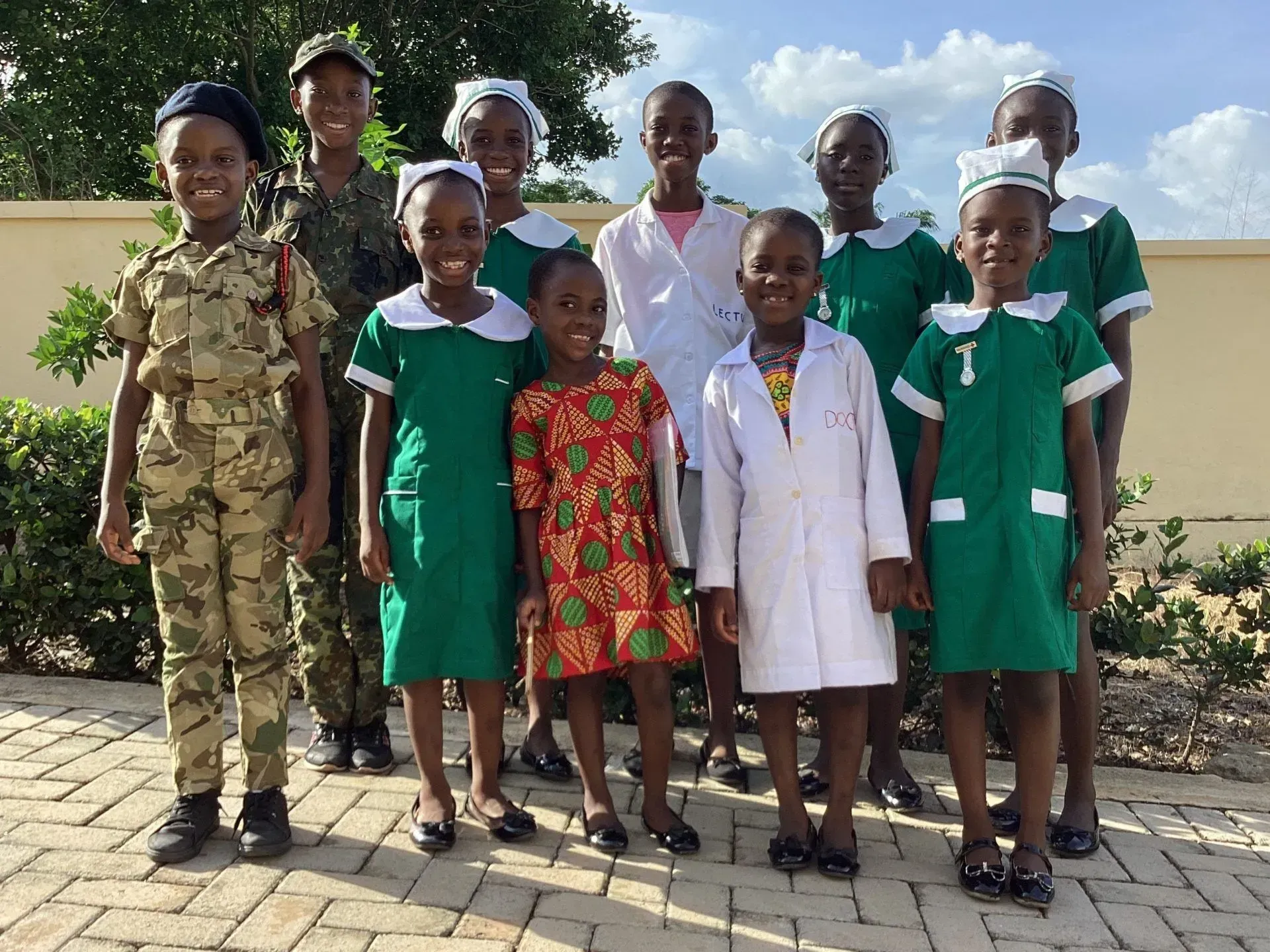 A group of children are posing for a picture together.