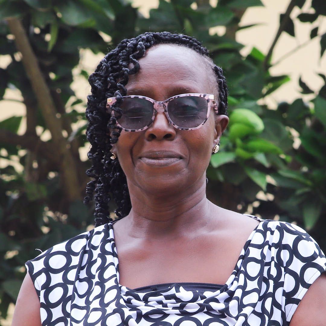 A woman wearing sunglasses and a black and white dress