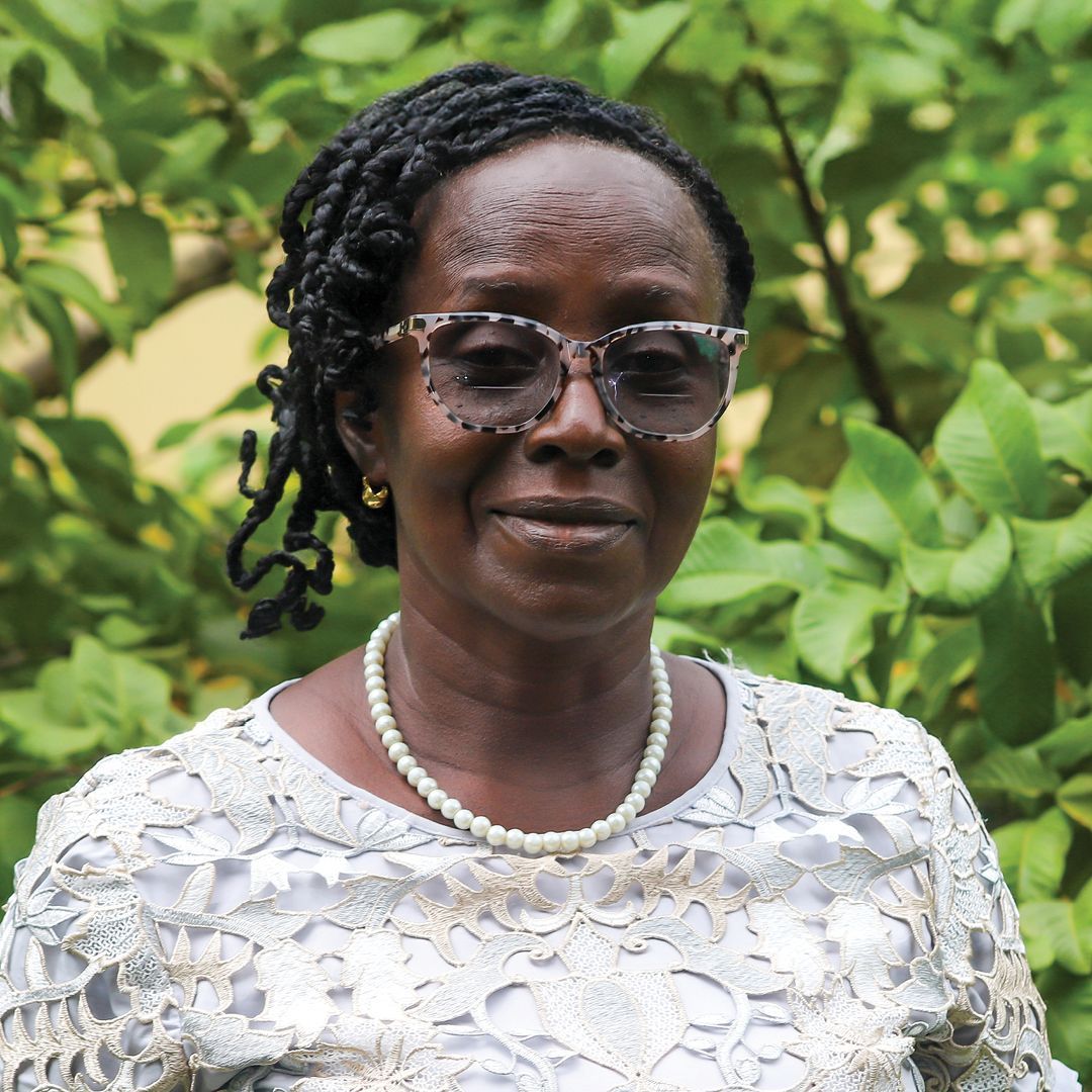 A woman wearing sunglasses and a black and white dress