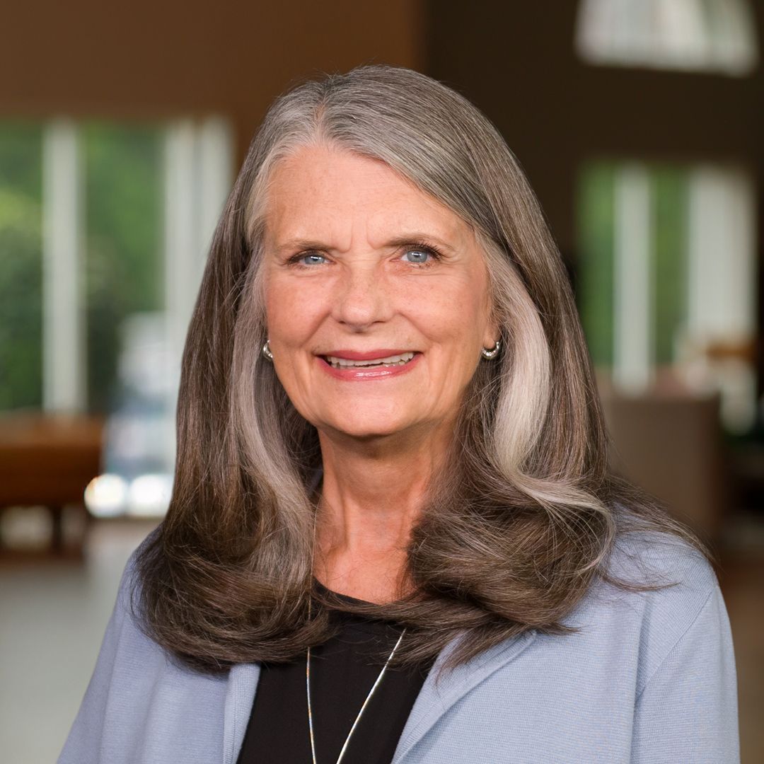 A man wearing a shirt that says ' lobster services ' on it